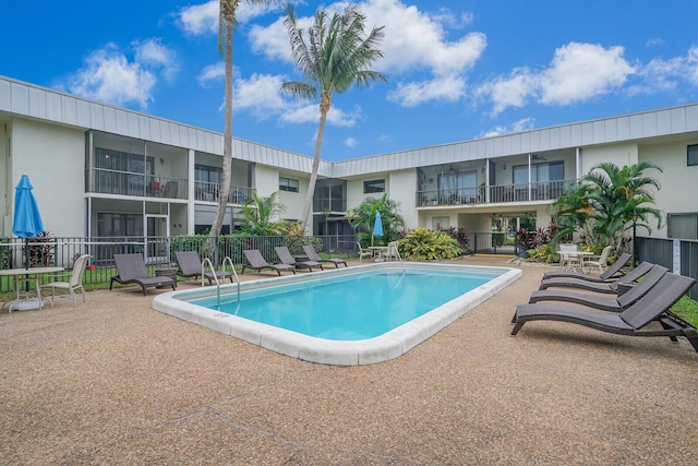 view of swimming pool featuring a patio