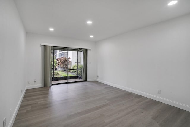 empty room with wood-type flooring