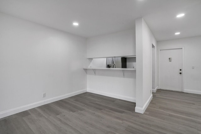 spare room featuring dark hardwood / wood-style floors