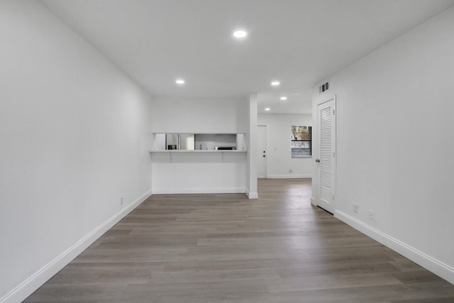 unfurnished living room with hardwood / wood-style floors