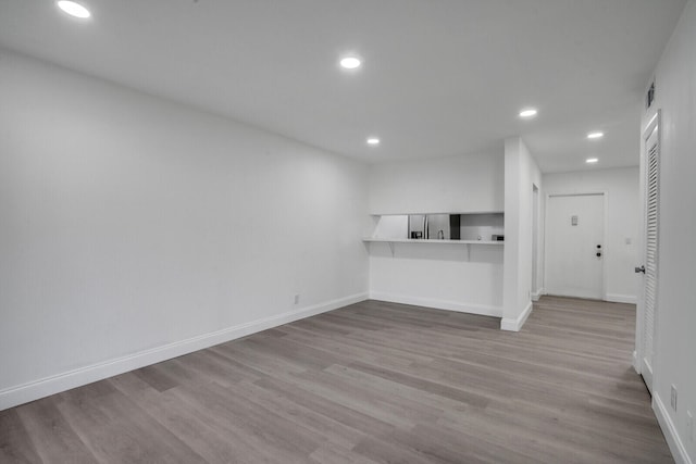 unfurnished living room with light hardwood / wood-style flooring