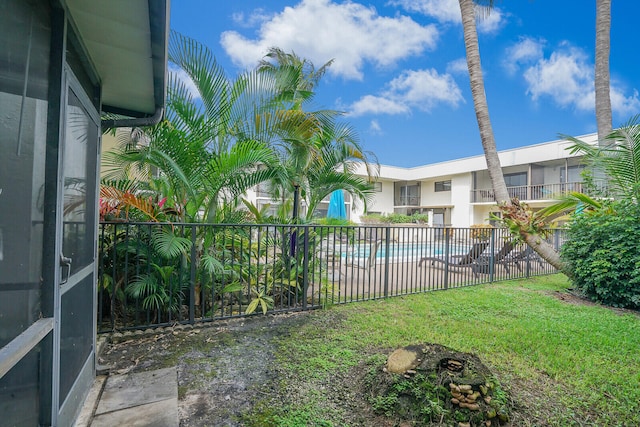 view of yard featuring a community pool