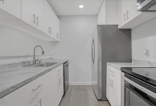 kitchen featuring sink and white cabinets