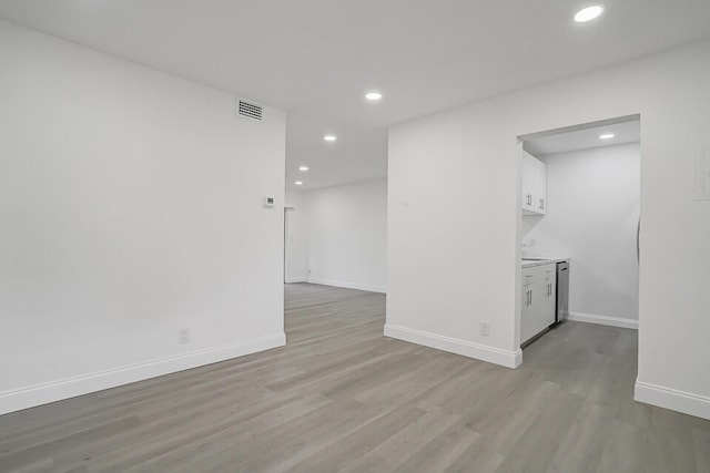 spare room with light hardwood / wood-style floors