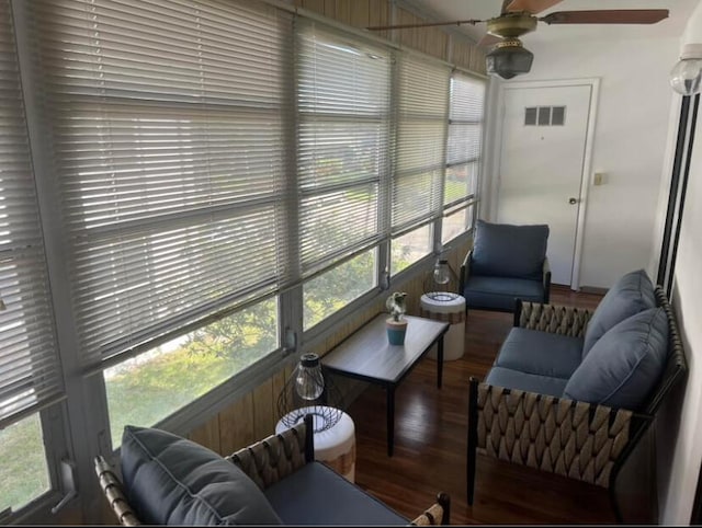 sunroom / solarium featuring ceiling fan and a wealth of natural light