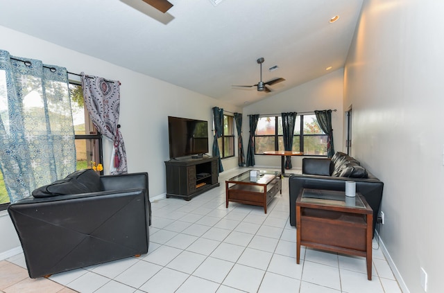 tiled living room with ceiling fan and vaulted ceiling