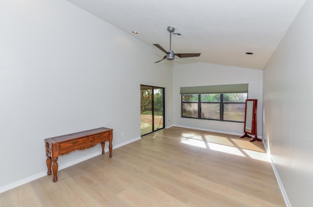 interior space featuring ceiling fan, lofted ceiling, and light wood-type flooring