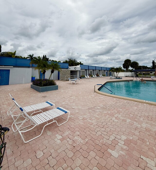 view of swimming pool with a patio area