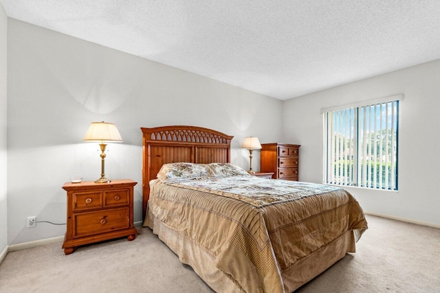 carpeted bedroom with a textured ceiling