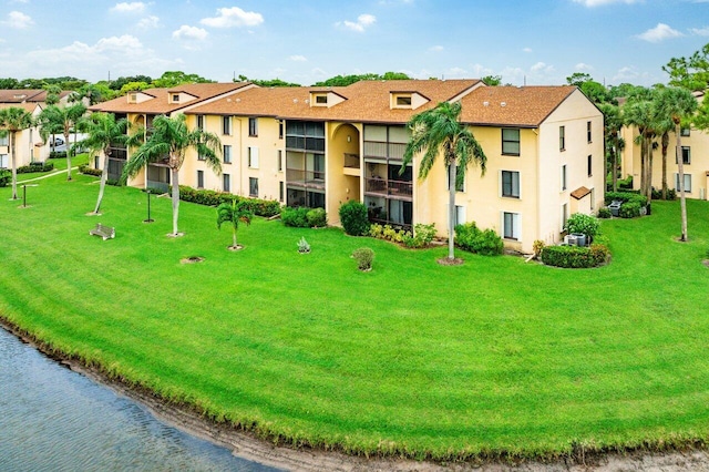 view of building exterior with a water view