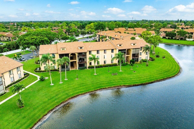 drone / aerial view with a water view