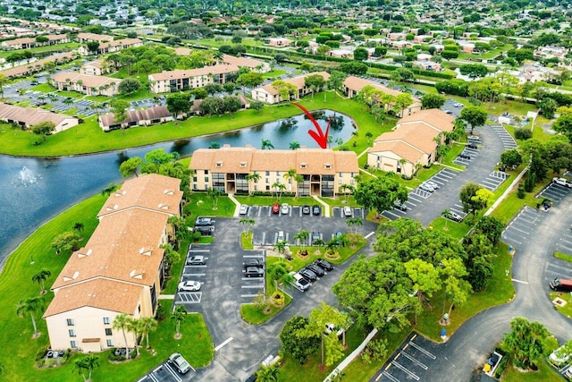 birds eye view of property featuring a water view