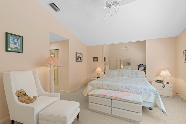 carpeted bedroom featuring ceiling fan and vaulted ceiling