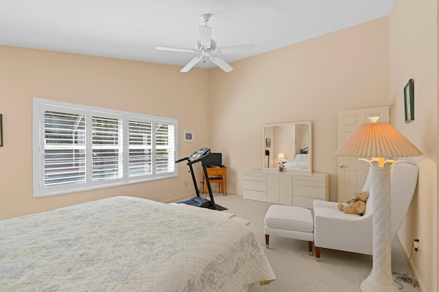 bedroom featuring light carpet and ceiling fan