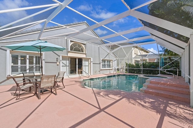 view of pool featuring a patio area and a lanai