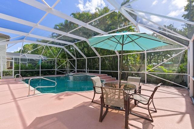 view of swimming pool featuring an in ground hot tub, a patio, and a lanai