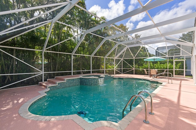 view of pool featuring a patio, an in ground hot tub, and glass enclosure