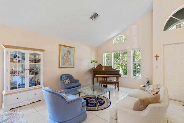 living room featuring light tile patterned flooring and high vaulted ceiling