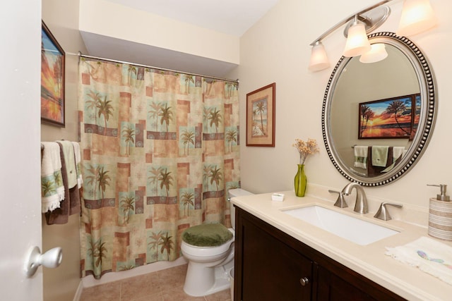 bathroom featuring tile patterned flooring, vanity, and toilet