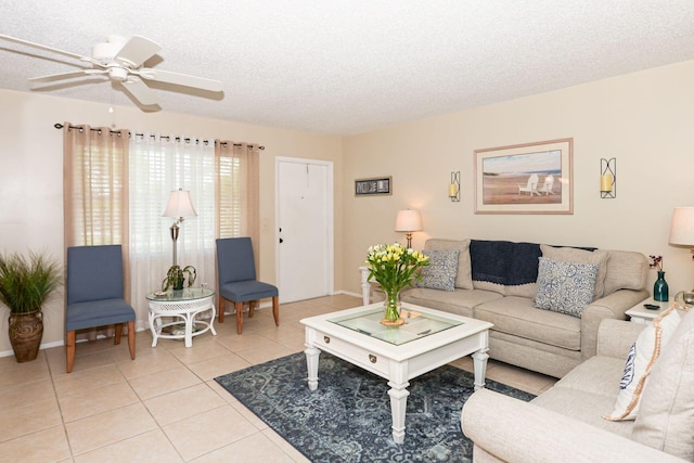 tiled living room with a textured ceiling and ceiling fan