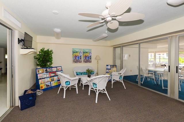 dining area featuring ceiling fan and carpet floors