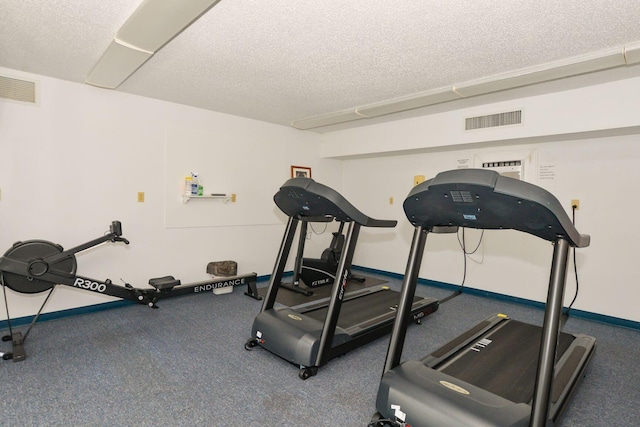 workout room with a textured ceiling