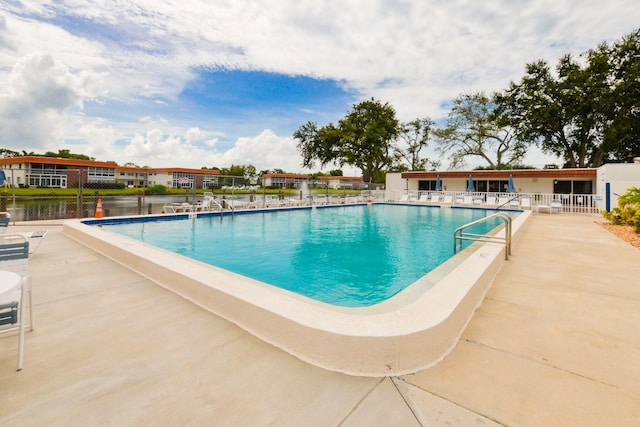 view of swimming pool featuring a patio