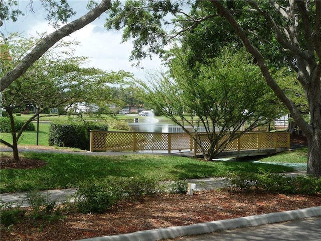 view of home's community with a lawn