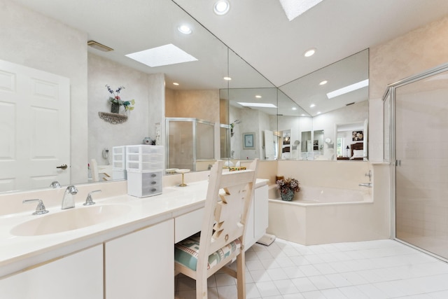 bathroom with tile patterned flooring, vanity, separate shower and tub, and vaulted ceiling with skylight