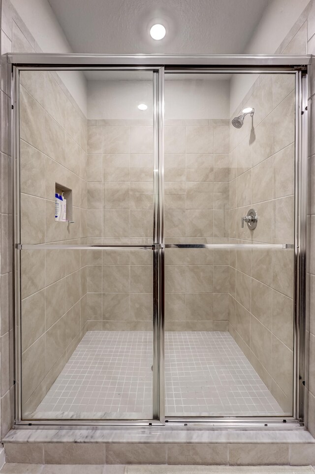 bathroom featuring an enclosed shower