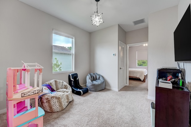 recreation room with carpet flooring