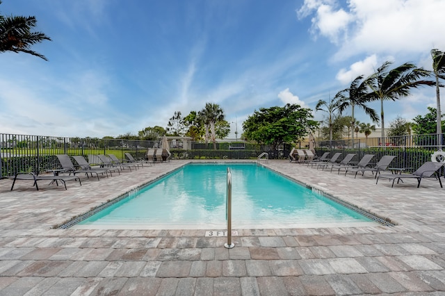 view of swimming pool featuring a patio area