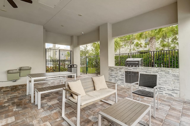 view of patio with an outdoor kitchen and a grill