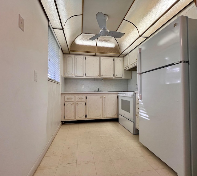 kitchen with ceiling fan, white appliances, and sink