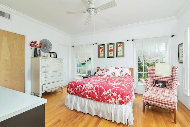 5400 Essex Ct, West Palm Beach, FL 33405 - bedroom featuring ceiling fan, wood-type flooring, crown molding, and multiple windows