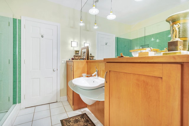5400 Essex Ct, West Palm Beach, FL 33405 - bathroom featuring tile patterned floors, a shower with shower door, and sink