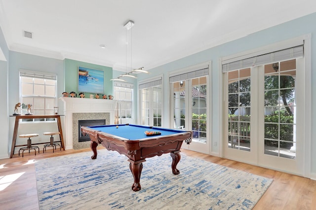 game room featuring ornamental molding, light hardwood / wood-style flooring, and pool table