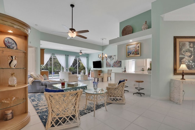 living room featuring light tile patterned flooring and ceiling fan with notable chandelier