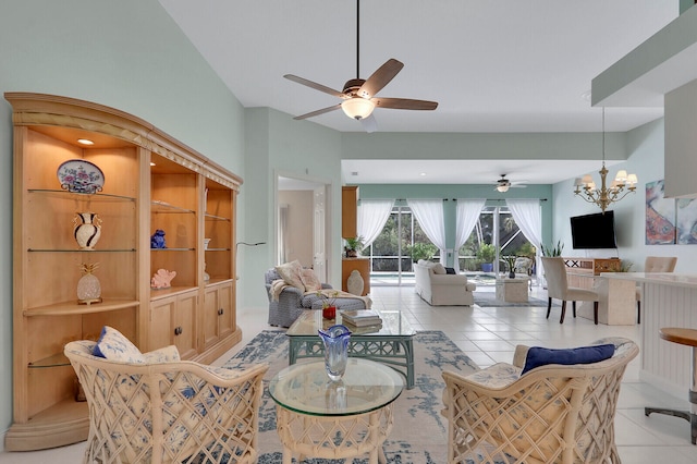 living room featuring ceiling fan with notable chandelier and light tile patterned floors