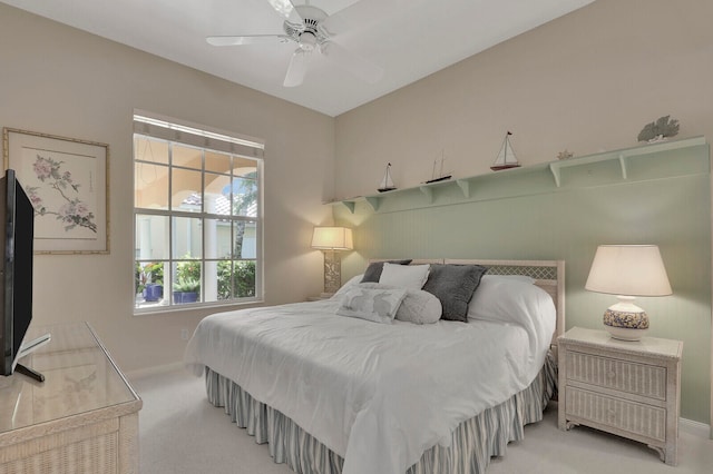 bedroom with light colored carpet and ceiling fan