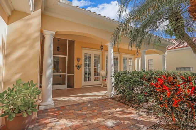 entrance to property featuring french doors