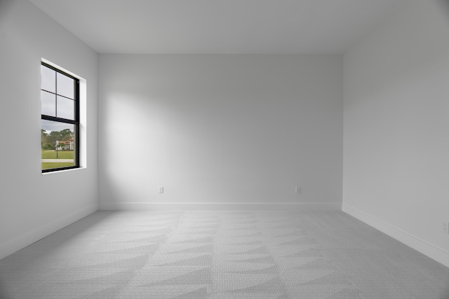 empty room featuring light colored carpet