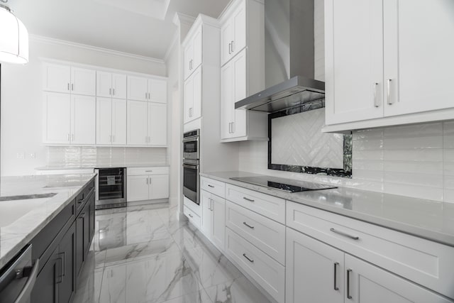 kitchen featuring decorative backsplash, wall chimney exhaust hood, stainless steel appliances, beverage cooler, and white cabinets