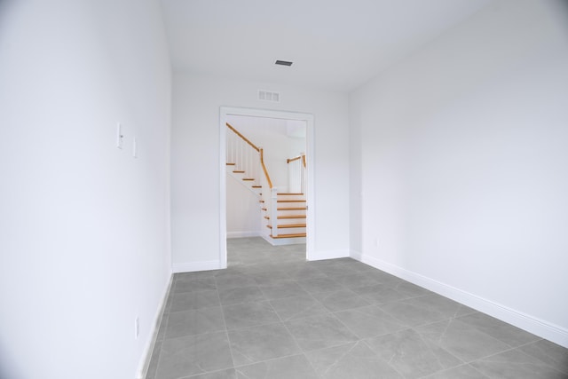 corridor featuring light tile patterned floors