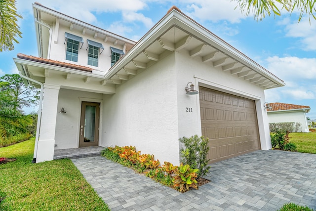 exterior space with a lawn and a garage