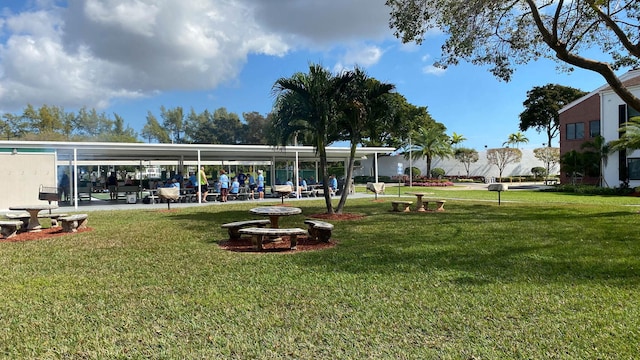 view of home's community featuring a lawn