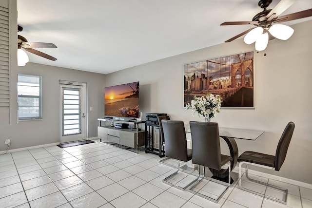 dining room with light tile patterned floors and ceiling fan