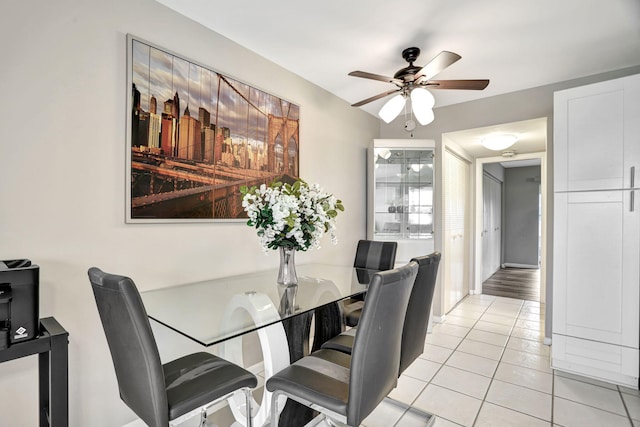 dining area with ceiling fan and light hardwood / wood-style floors