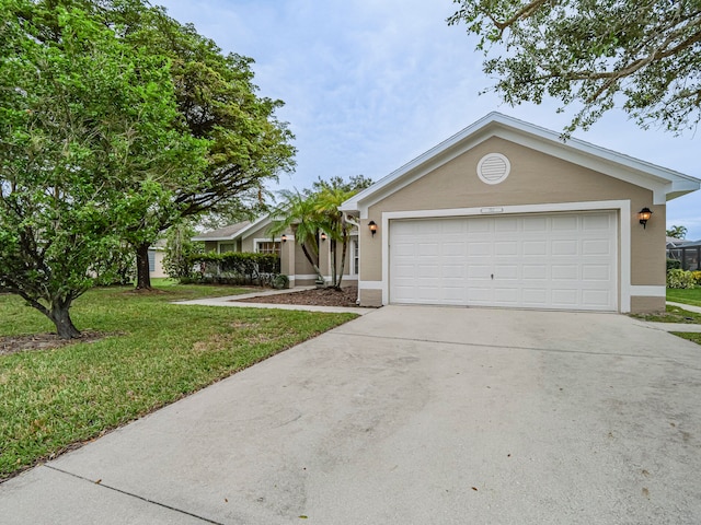 single story home featuring a front yard and a garage