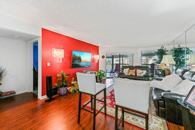 living room featuring hardwood / wood-style floors and a textured ceiling